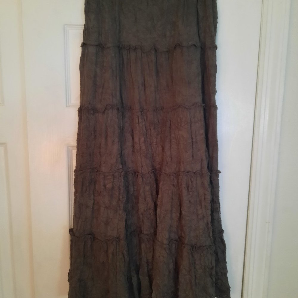 Women's long green skirt with ruffles between panels